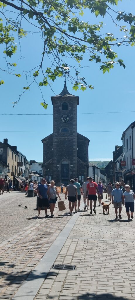 A photo of KEswick town with the historic Moot Hall framed centrally